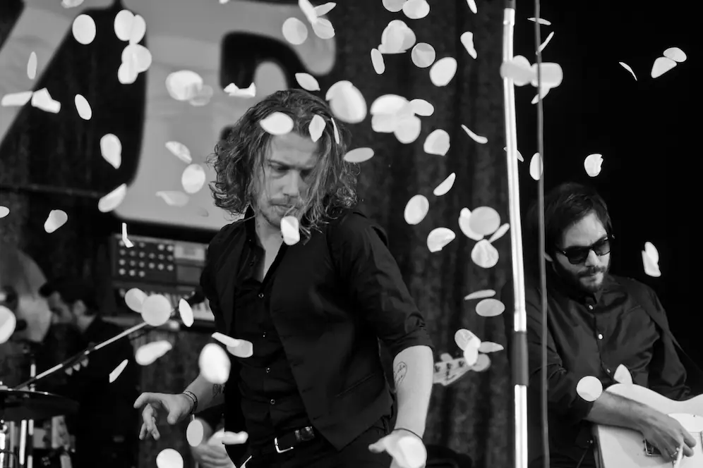 An on-stage performer with confetti falling