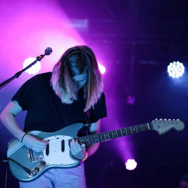 A guitarist performs live on-stage