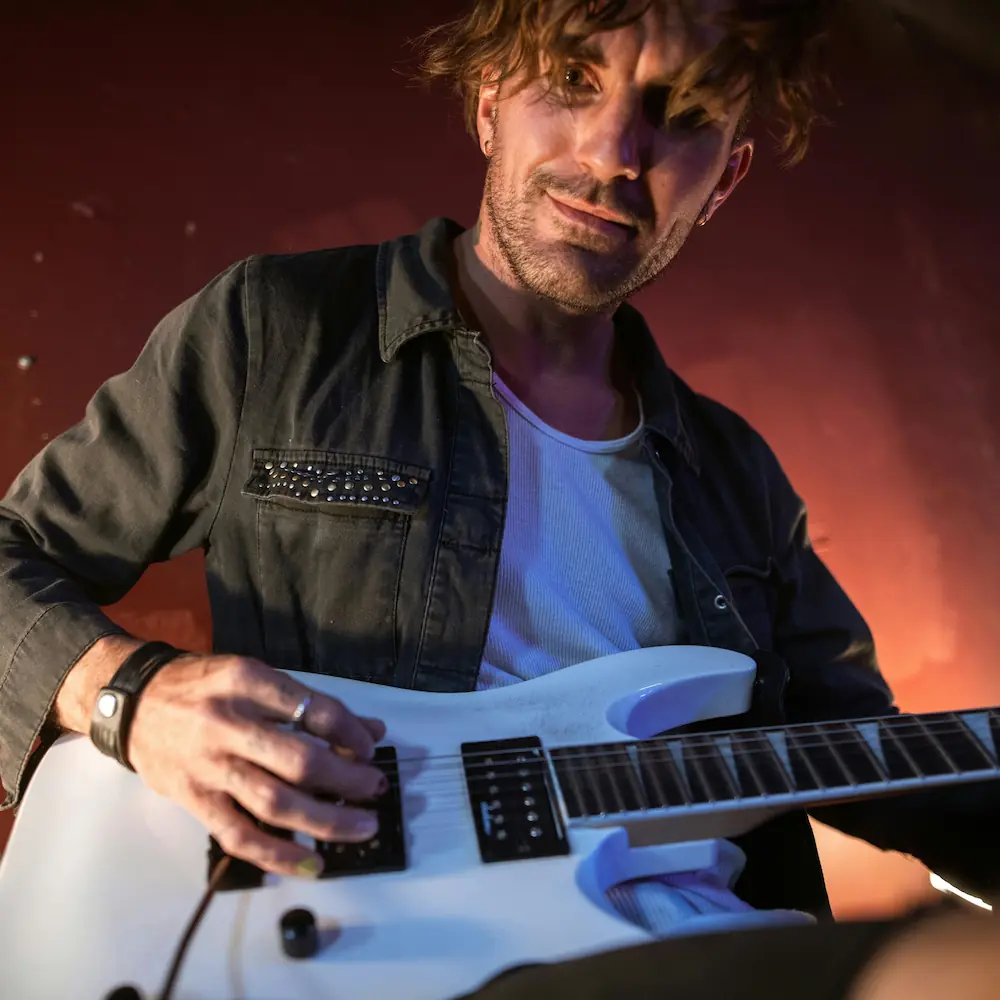 A guitarist performing live