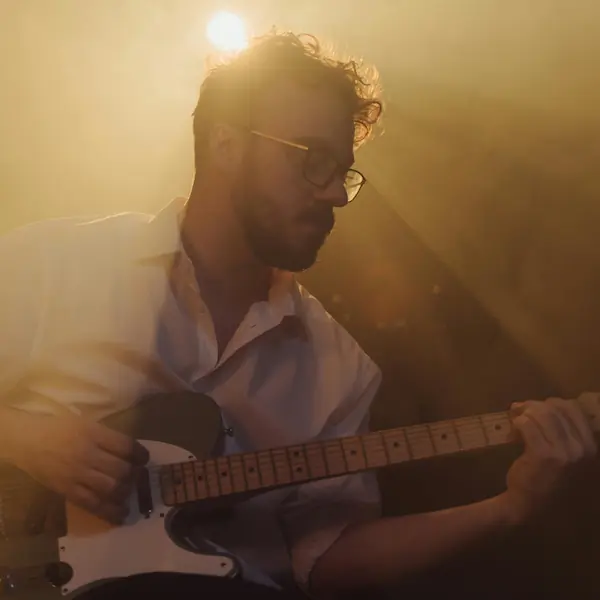 A guitarist performs live on-stage